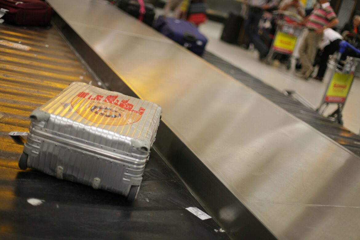 Luggage dxb a suitcase on a conveyor belt dxb airport